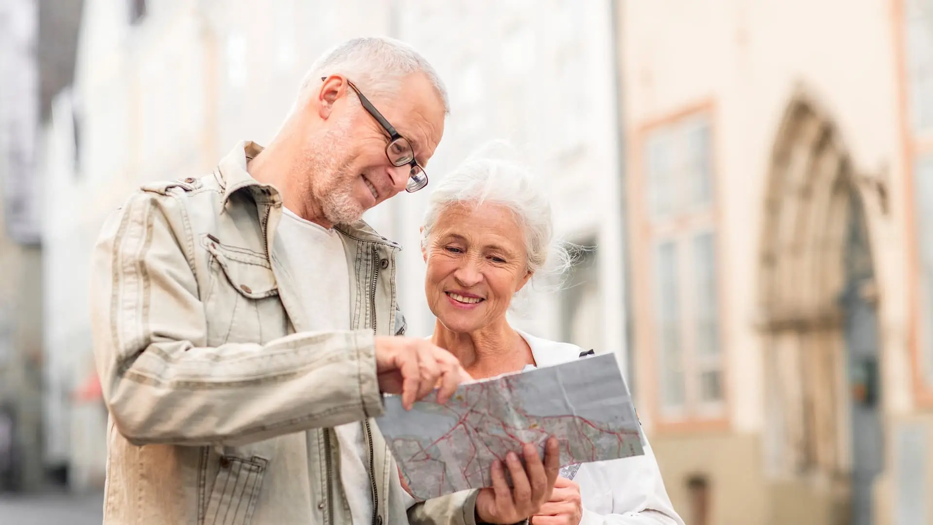 Couple looking at a map outdoors