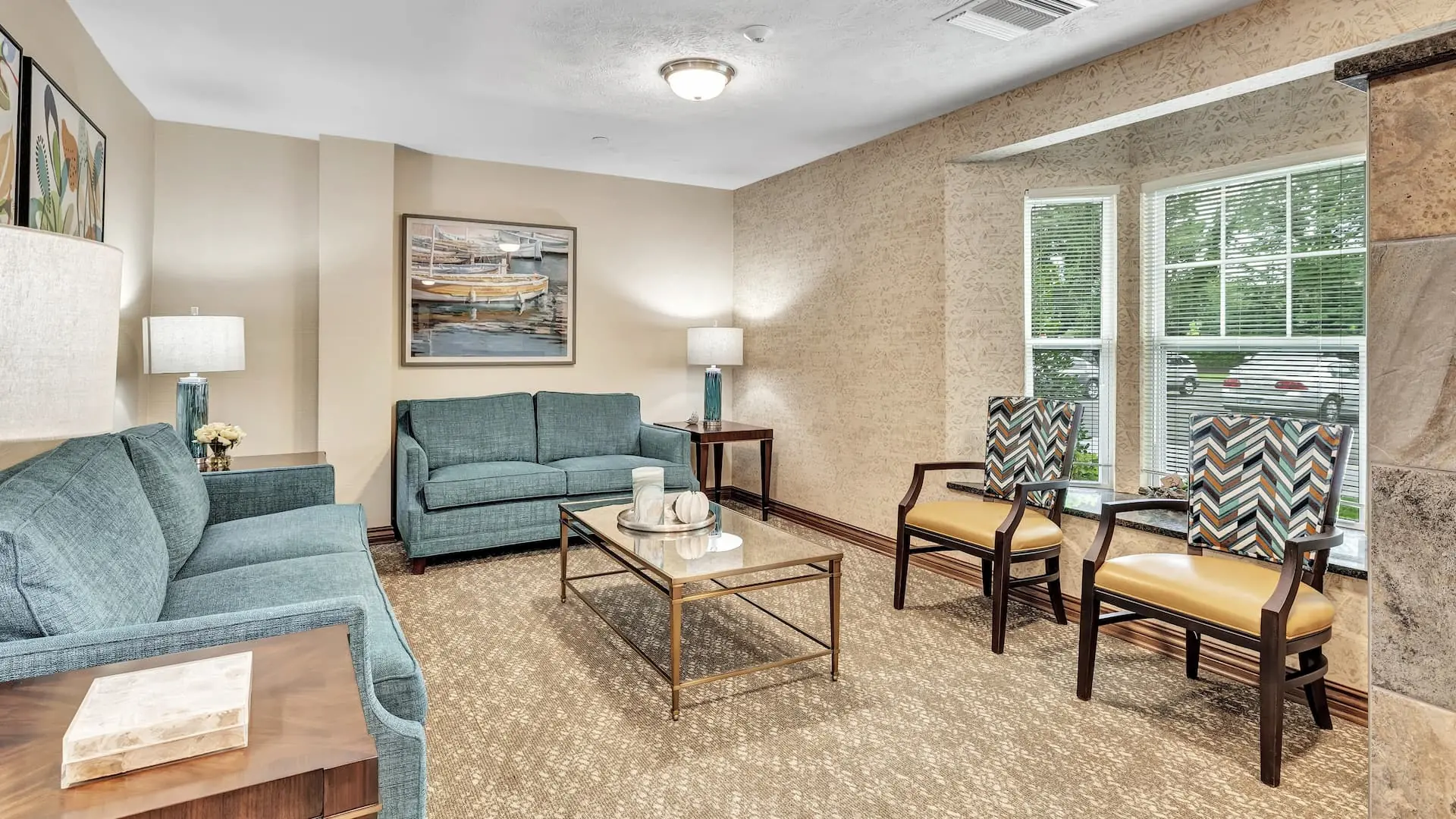 Cozy lounge area with seating and artwork