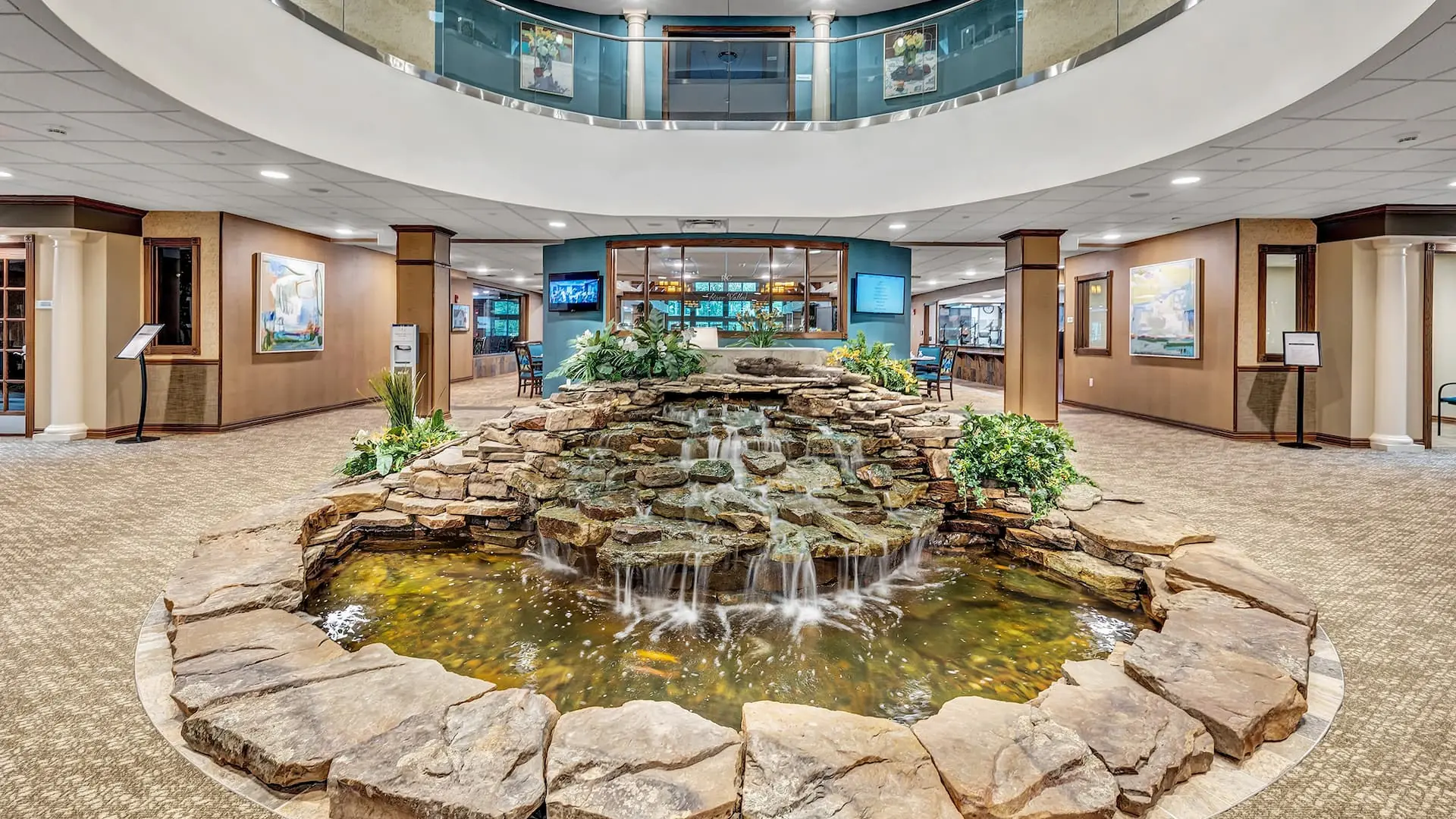 Interior space with a water feature and greenery