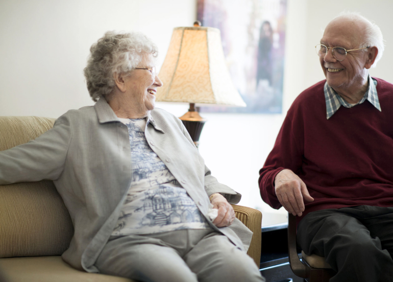 Residents enjoying a conversation in a common area