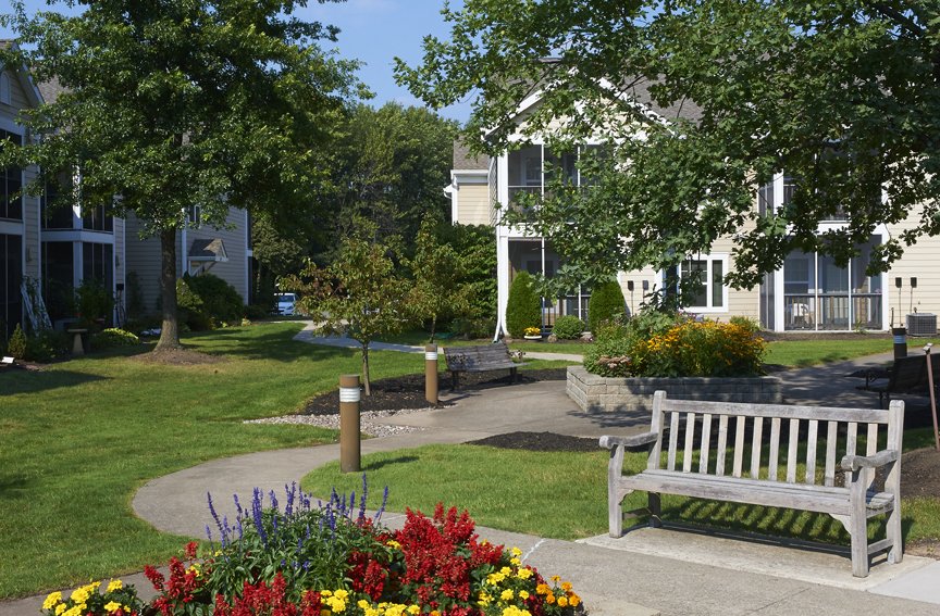 Beautiful landscaped outdoor area with flower beds and benches