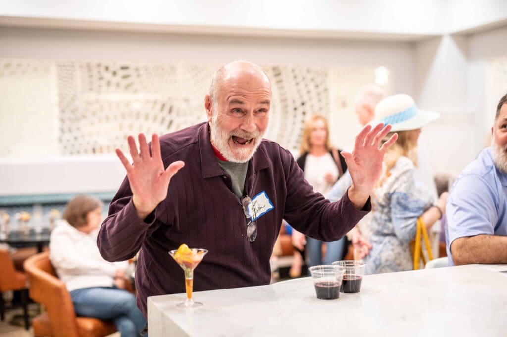 Resident enjoying a drink in a common area