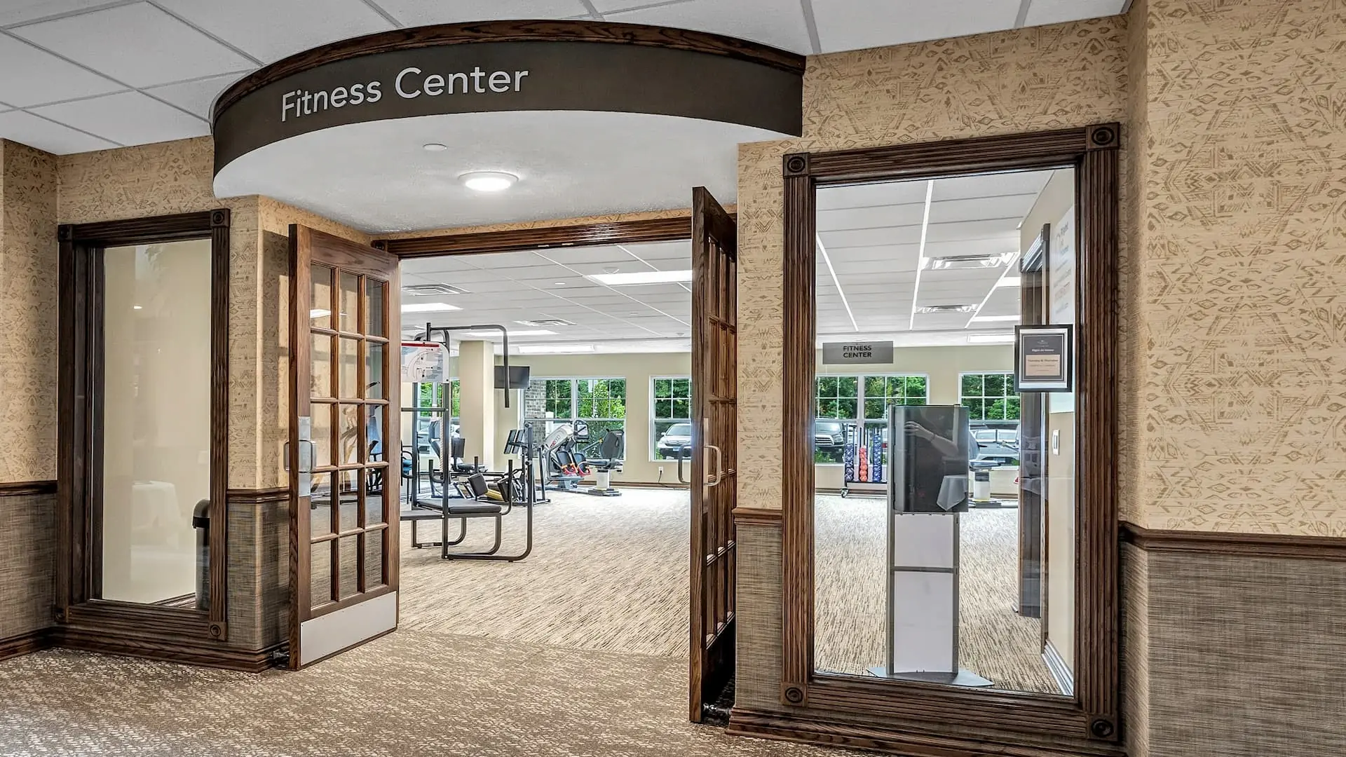 Entrance to the fitness center with gym equipment visible