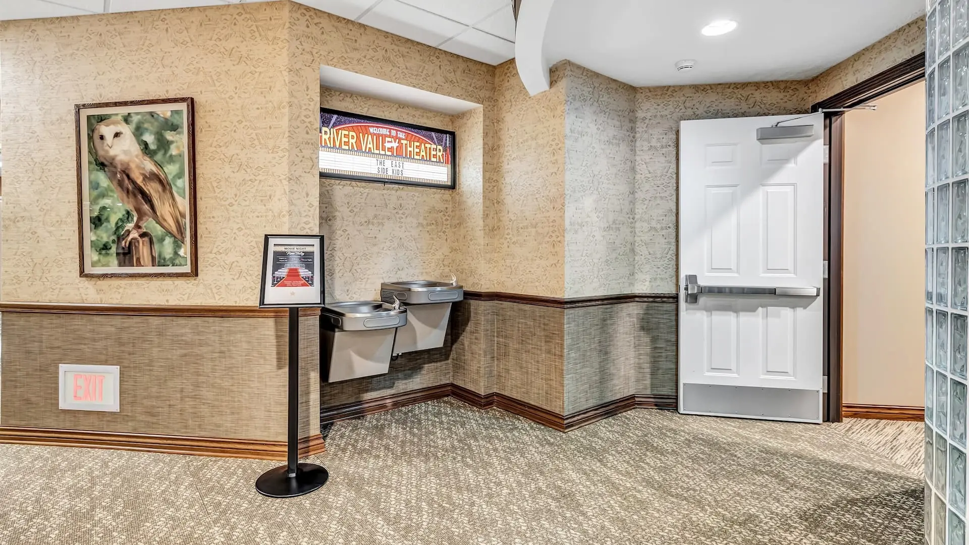 Interior hallway with water fountains and door