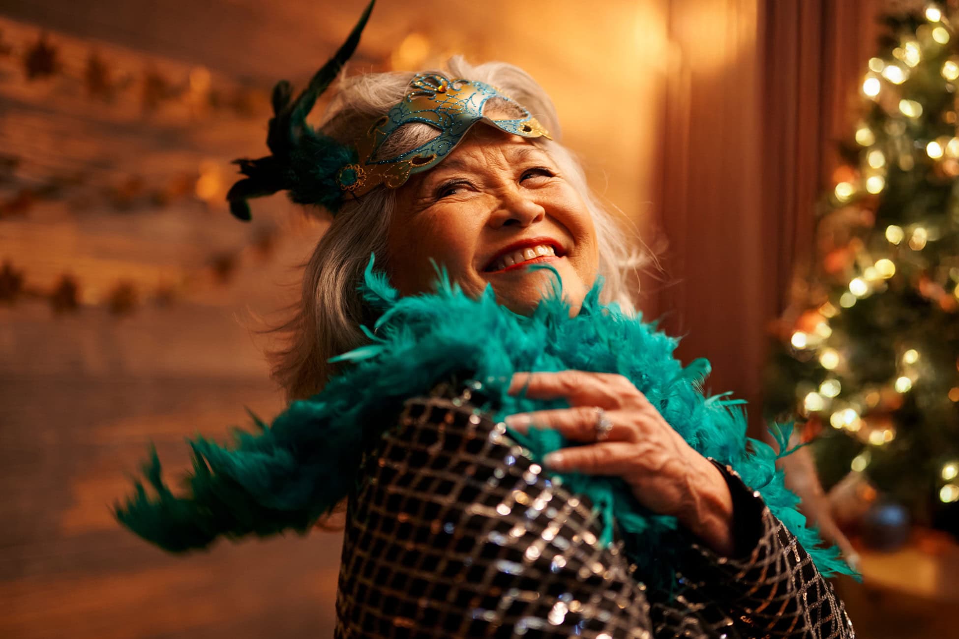 Woman enjoying a festive celebration with a feather boa