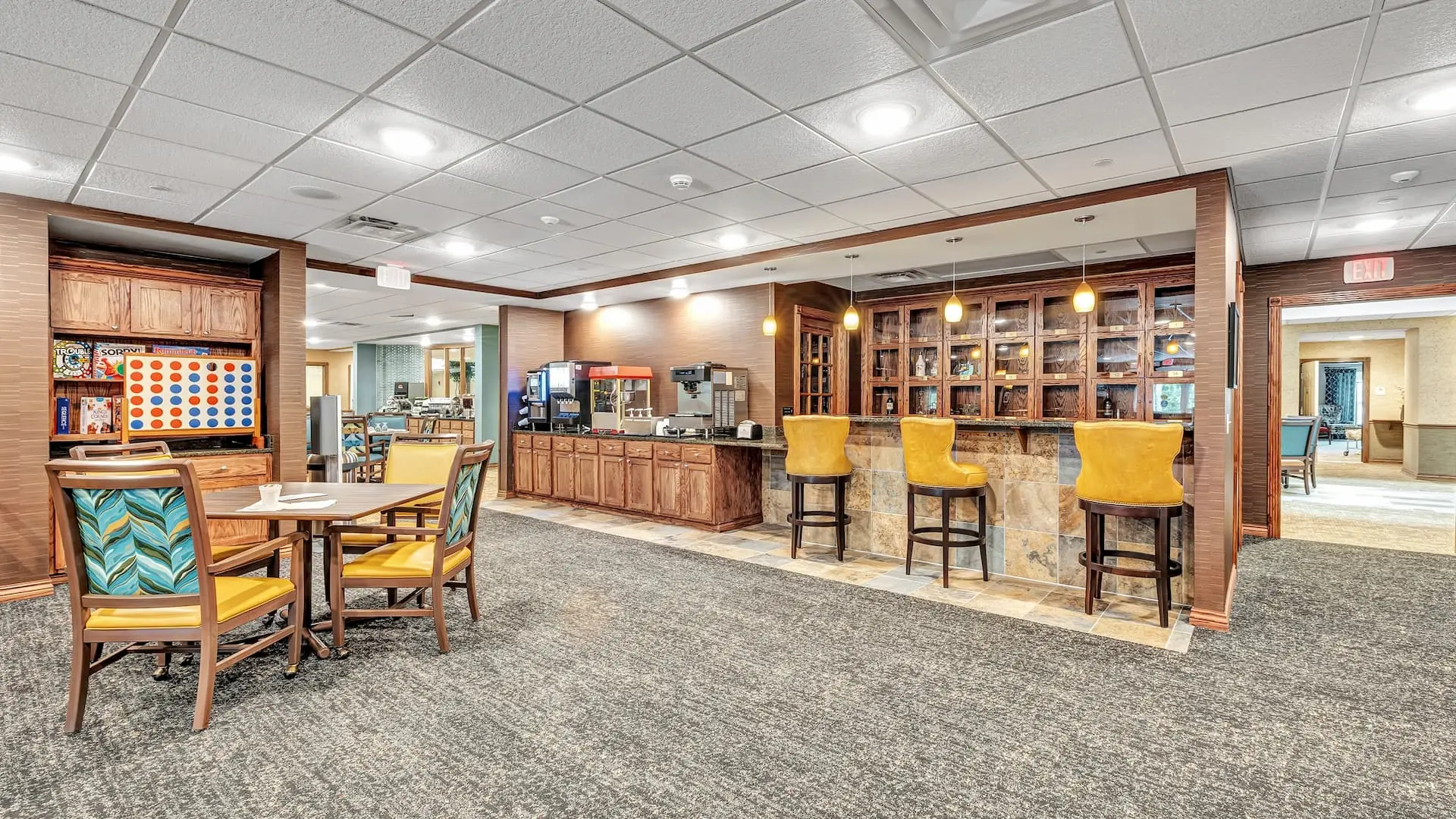 Bright common area with seating and coffee station