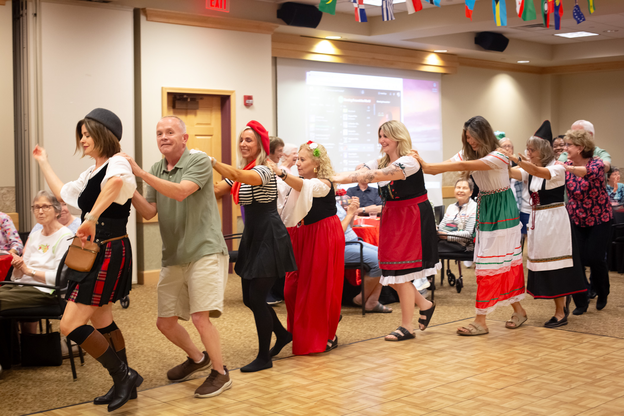 Residents and staff participating in a lively activity