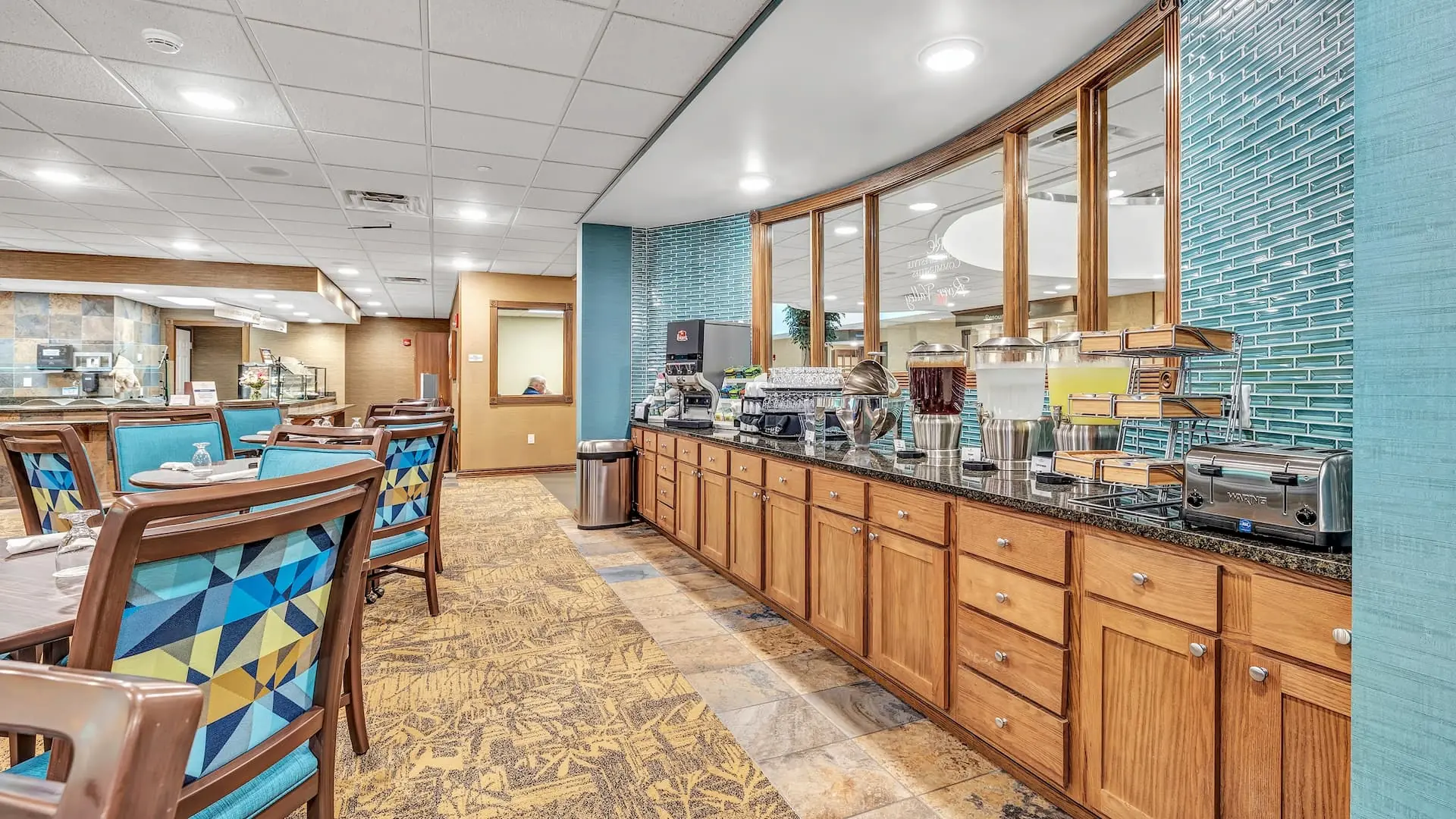 Interior dining area with beverage station and tables