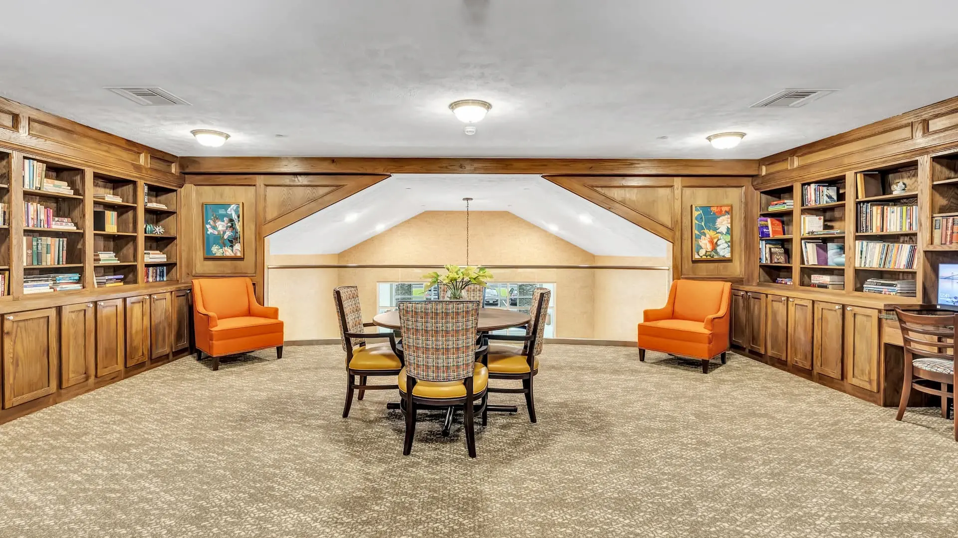 Bright common area with seating and bookshelves