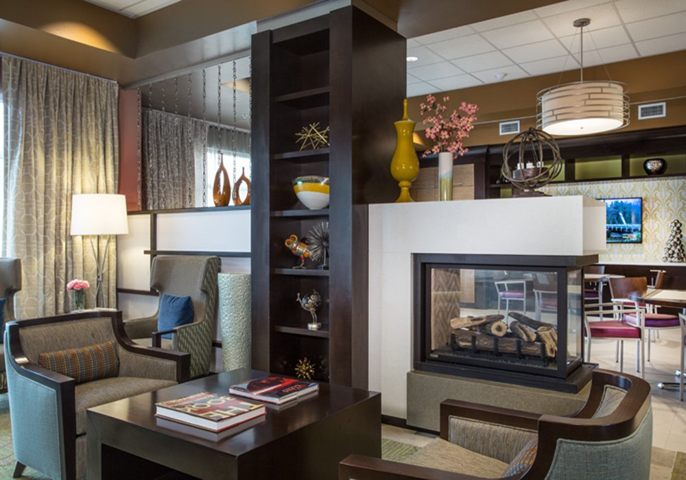 Cozy interior lounge area with seating and a fireplace
