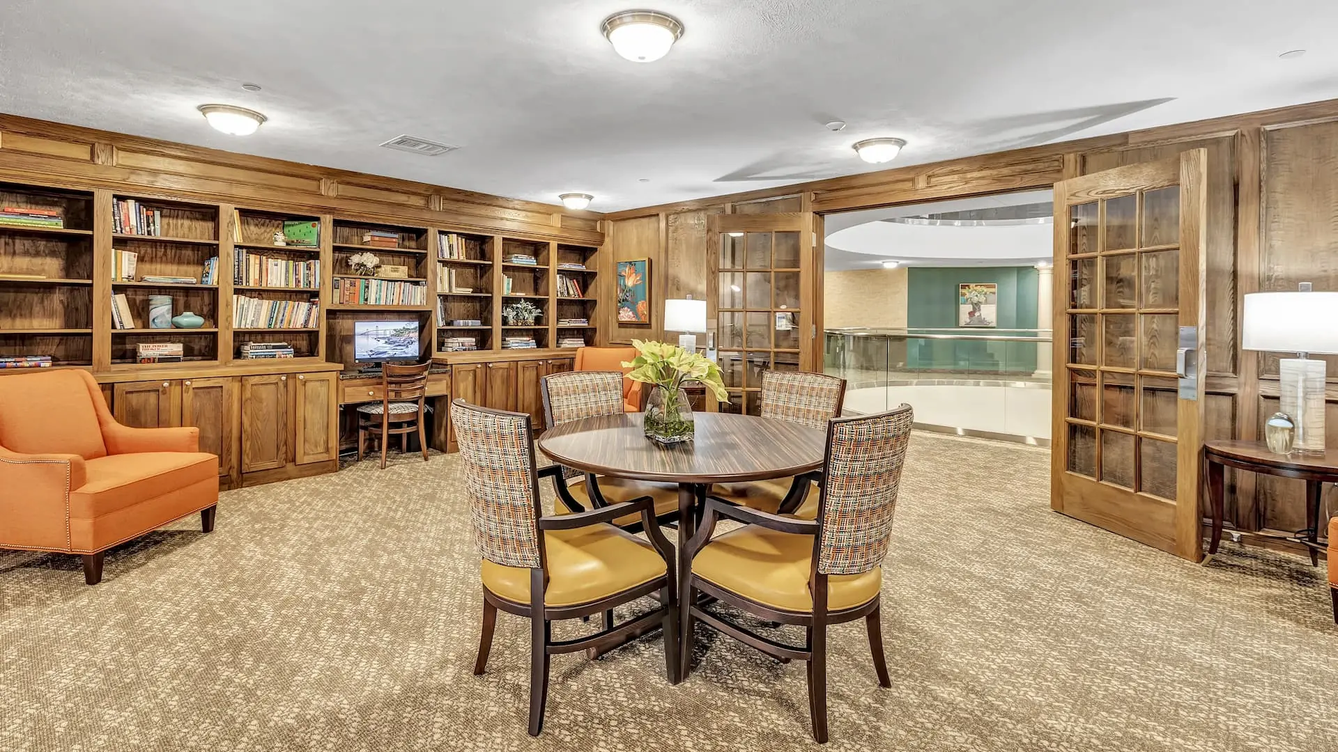 Cozy common area with bookshelves and seating