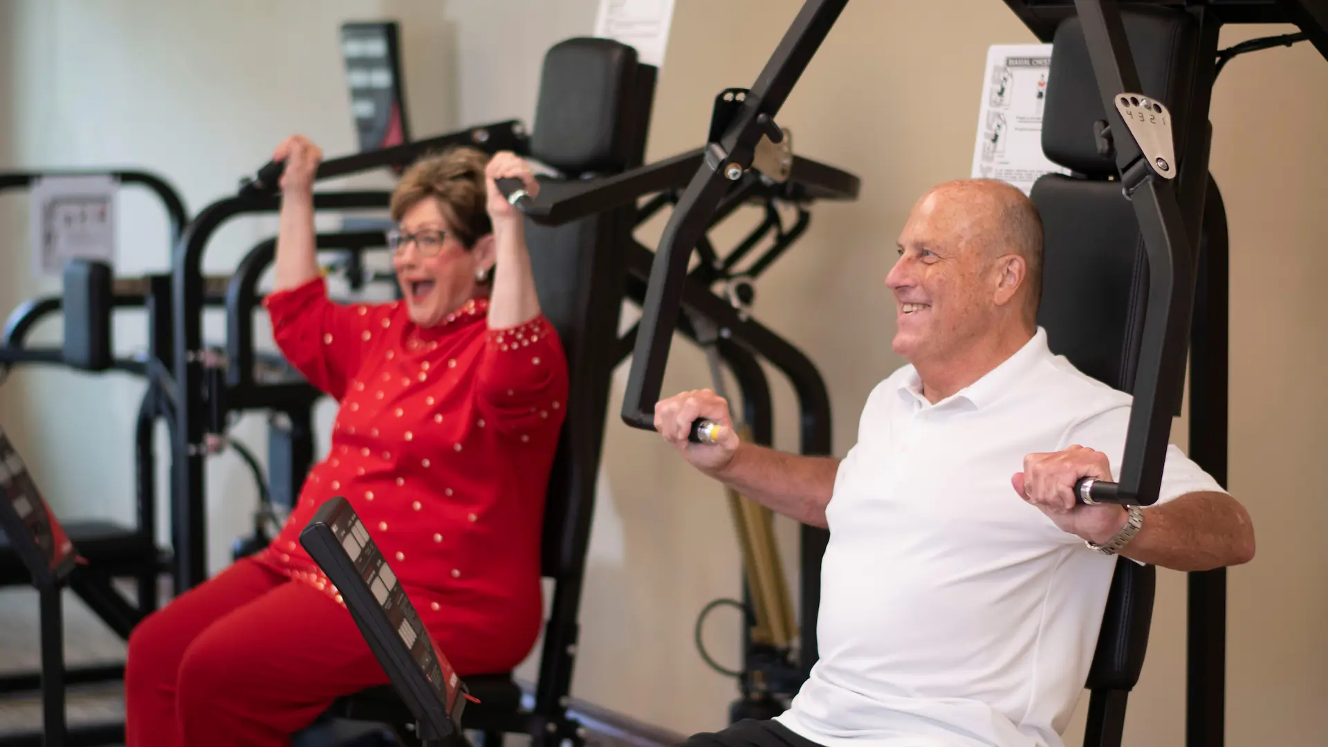 Residents participating in a fitness activity at the facility gym