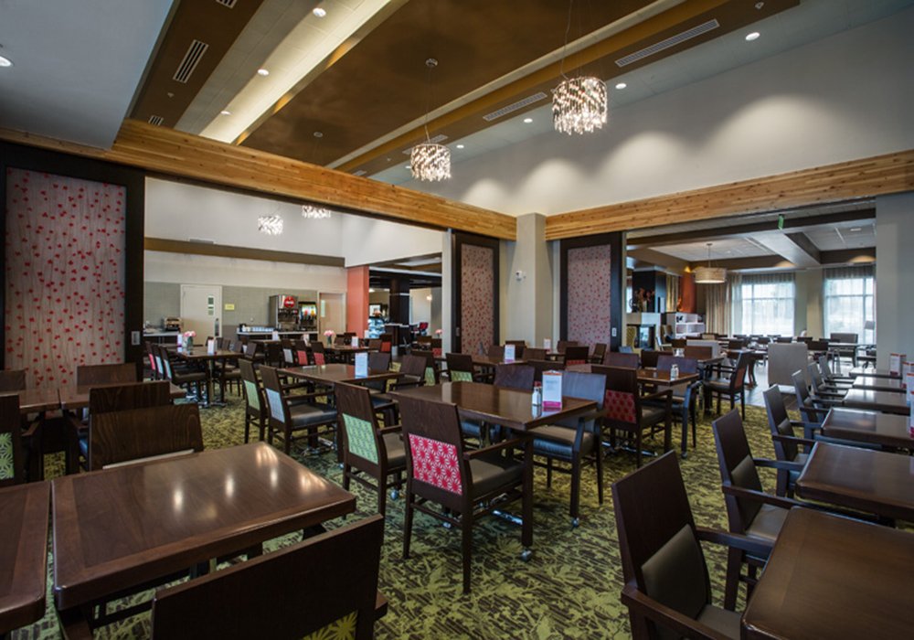 Bright and spacious dining area with tables and chairs