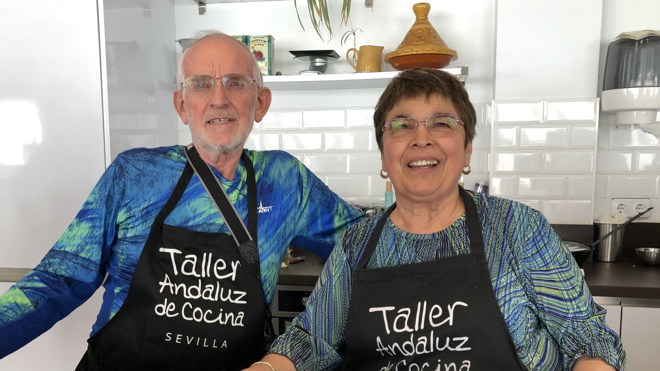 Two residents smiling in a kitchen setting