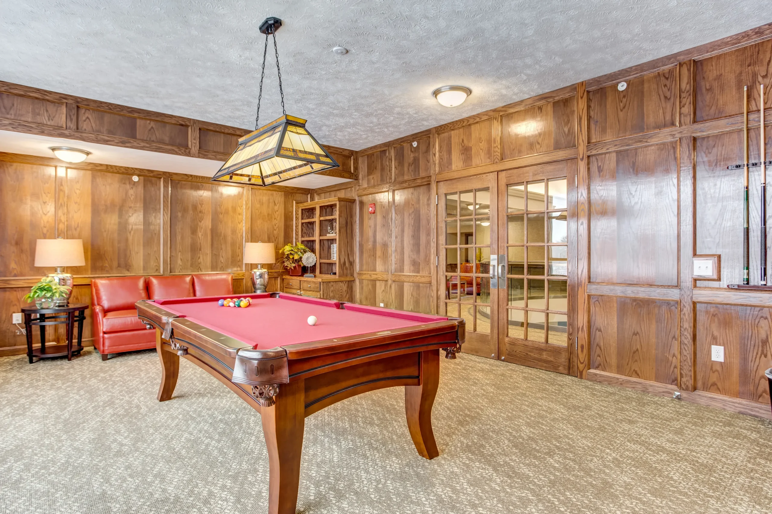 Interior common area with a pool table and seating