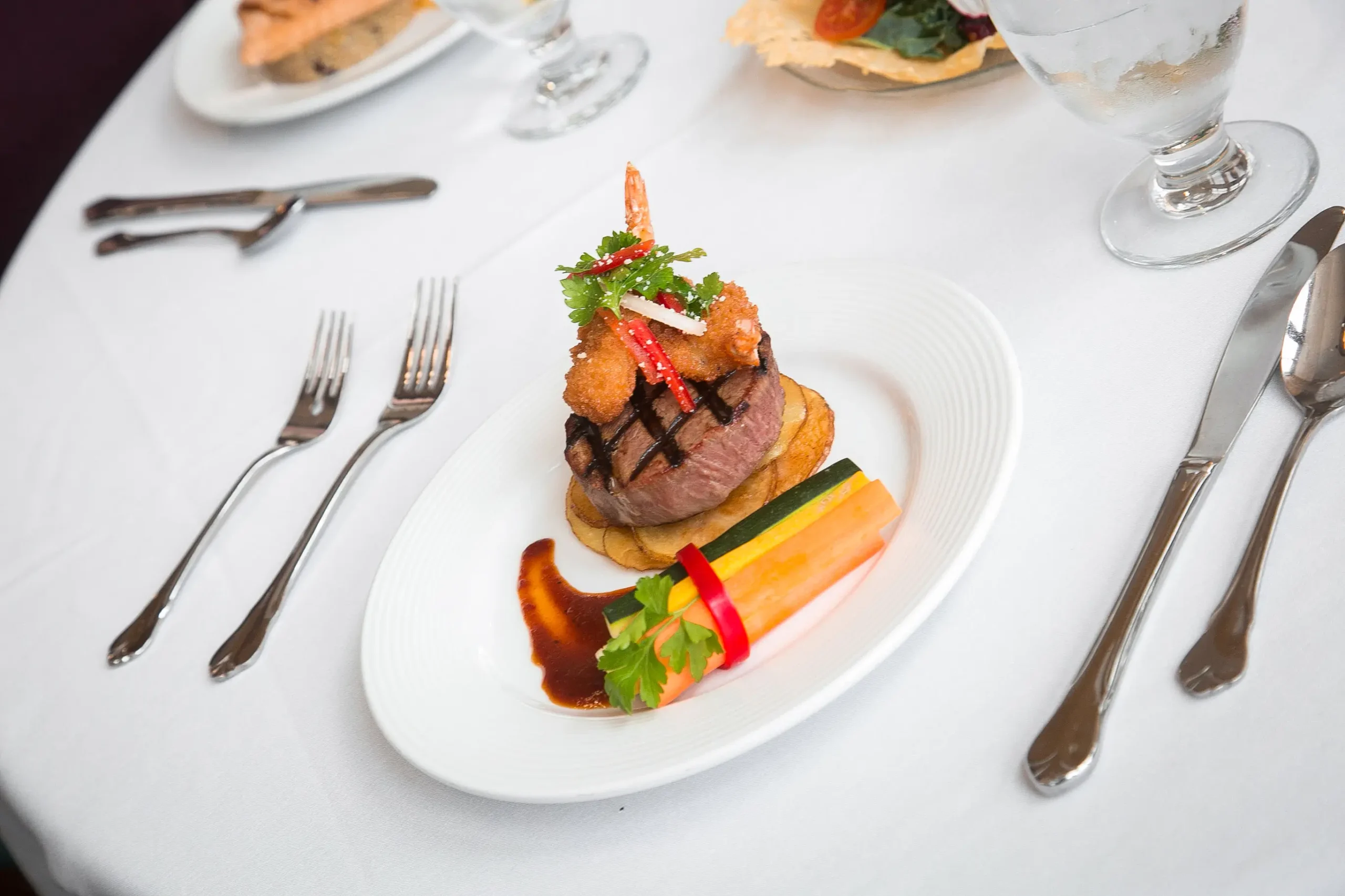A beautifully plated gourmet meal with vegetables