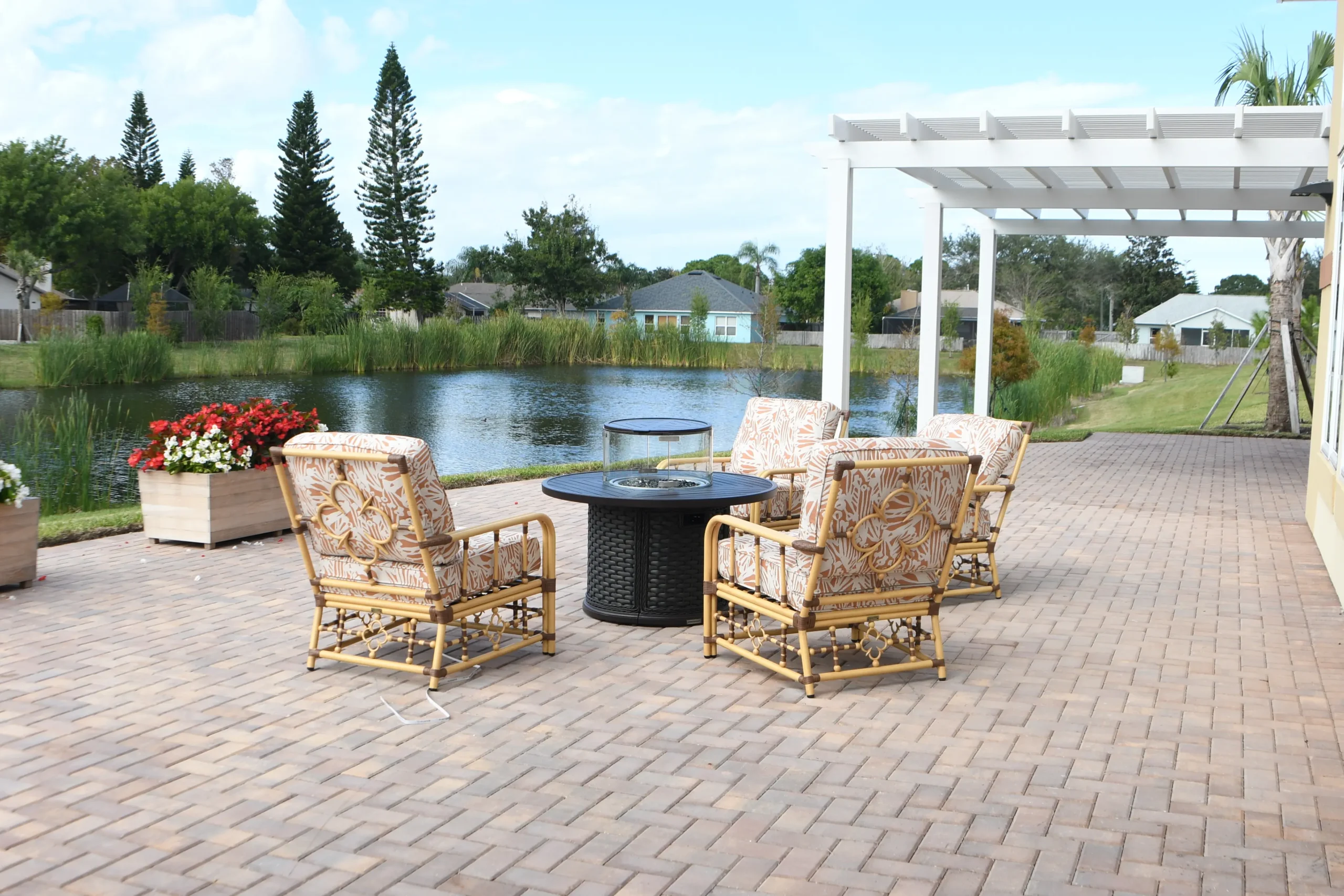 Outdoor seating area by a serene pond