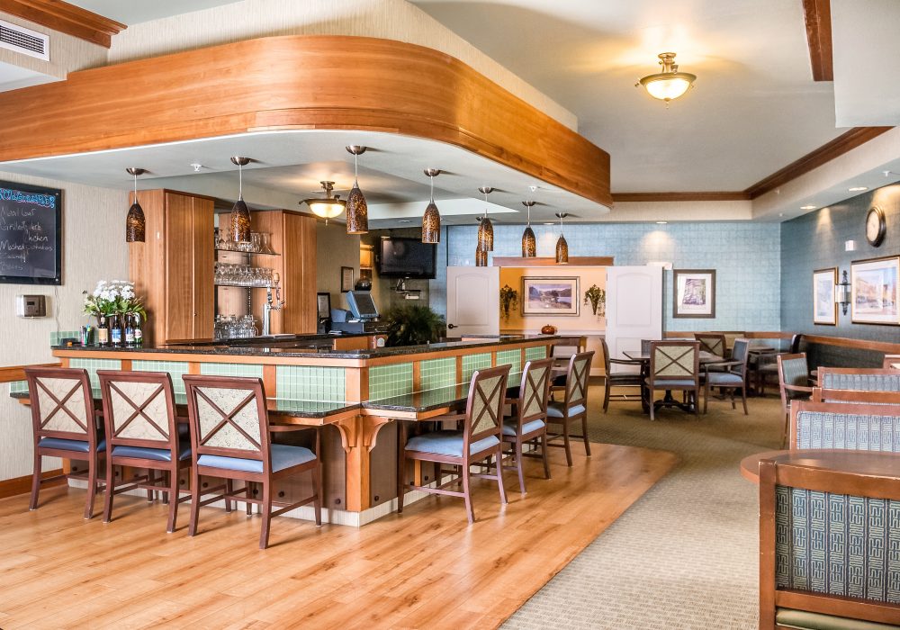 Bright common area with a bar and seating