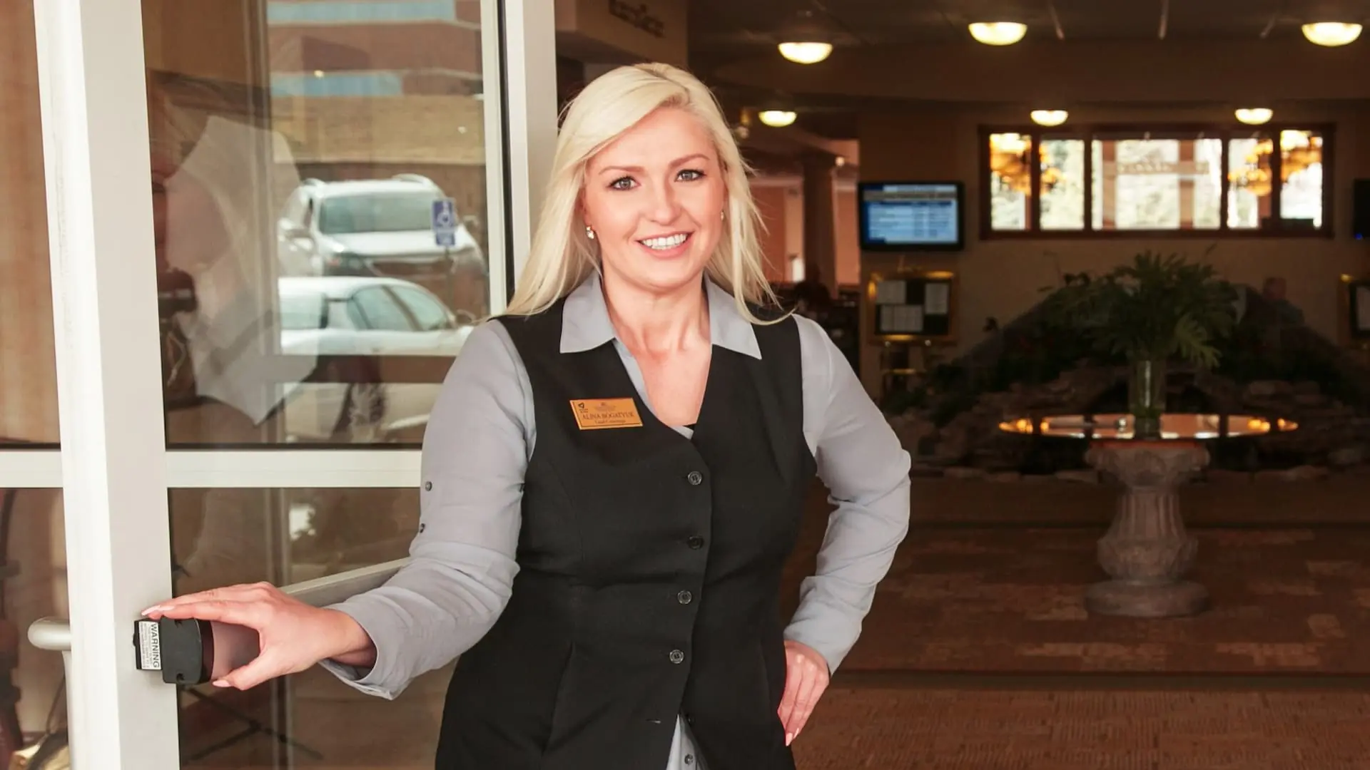 Staff member welcoming residents in the lobby area