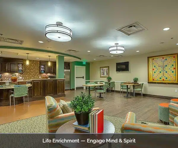 Bright common area with seating and a game table
