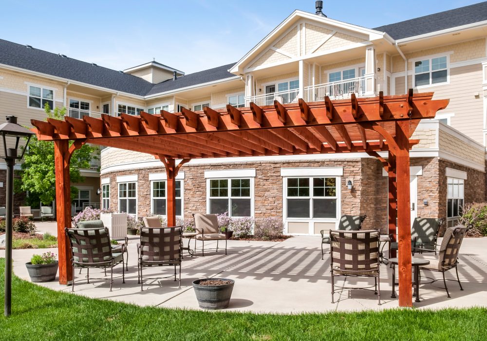 Outdoor patio area with seating and a pergola
