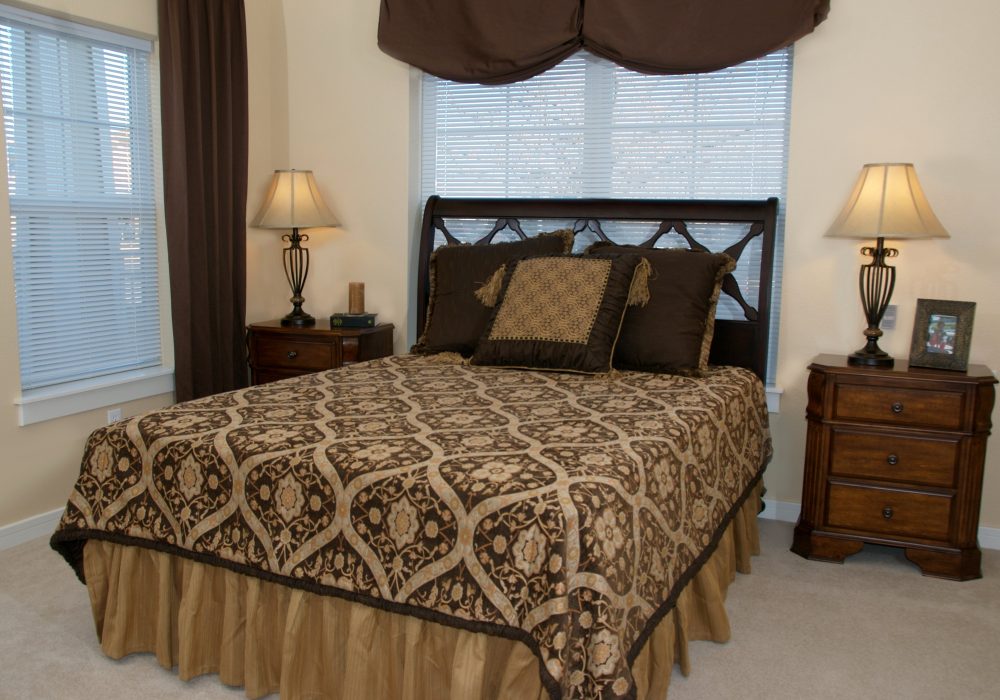 Cozy bedroom with a queen-sized bed and lamps