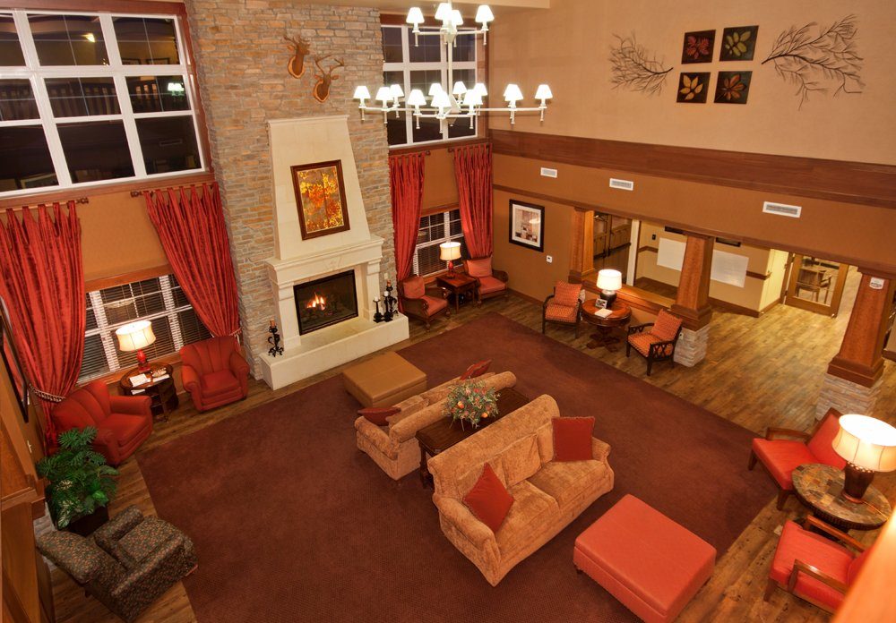 Spacious lobby area with comfortable seating and a fireplace