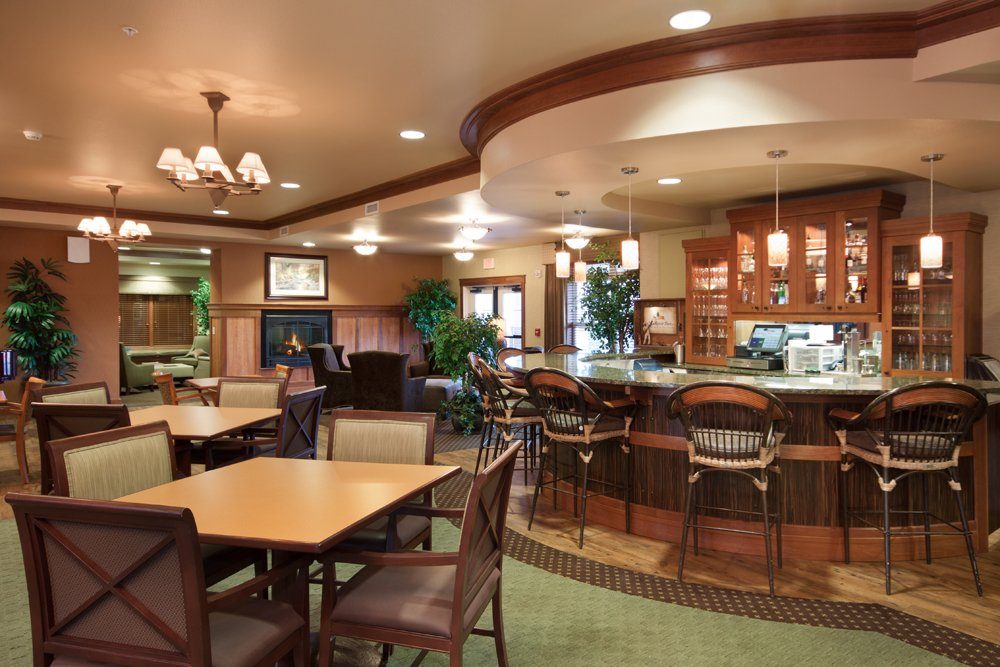 Interior of a dining room with seating and a bar