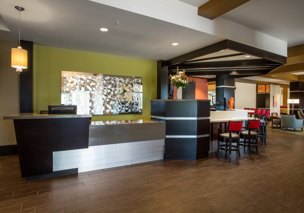 Modern lobby area with seating and reception desk