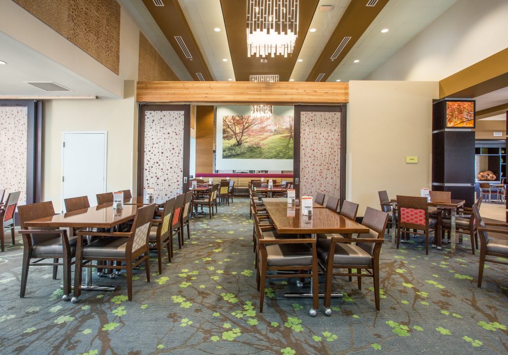 Dining area with tables and chairs in a facility