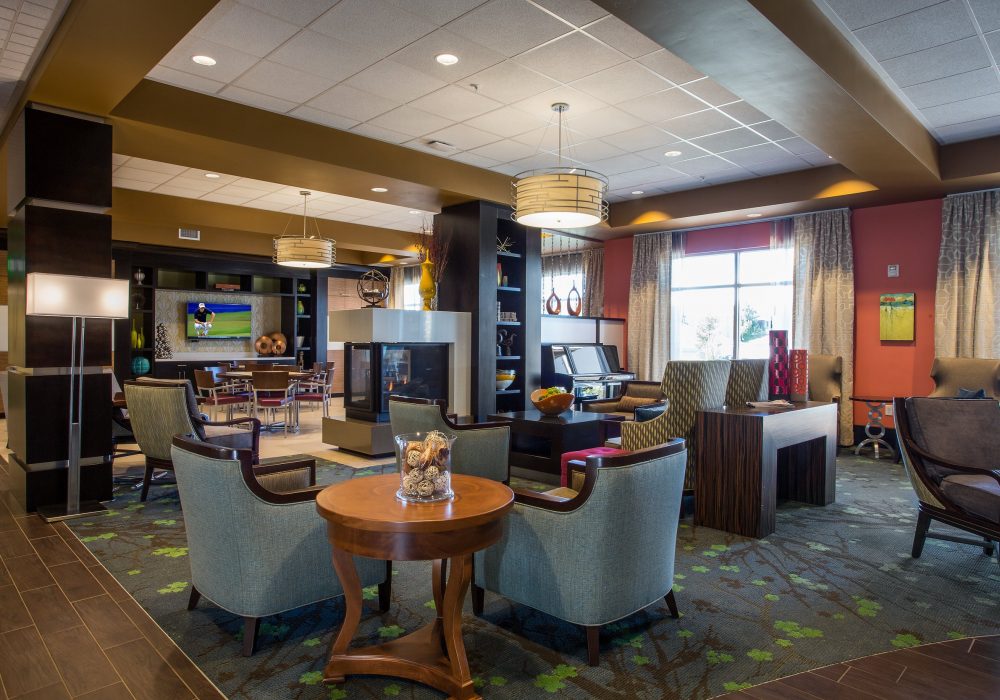Cozy common area with seating and a fireplace