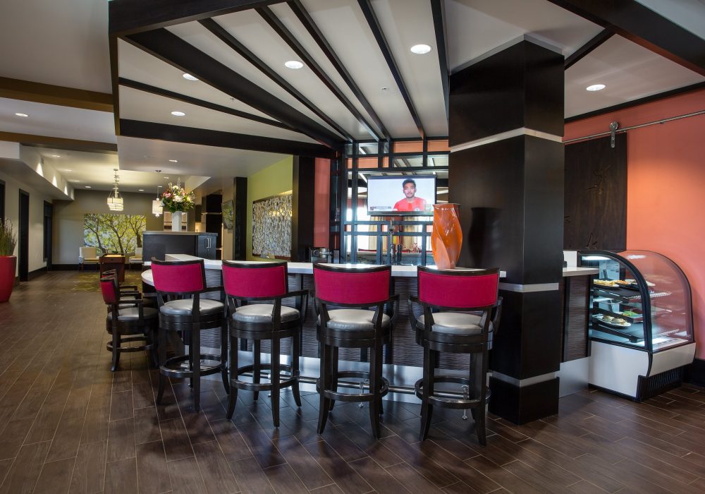 Interior view of a vibrant common area with seating and decor