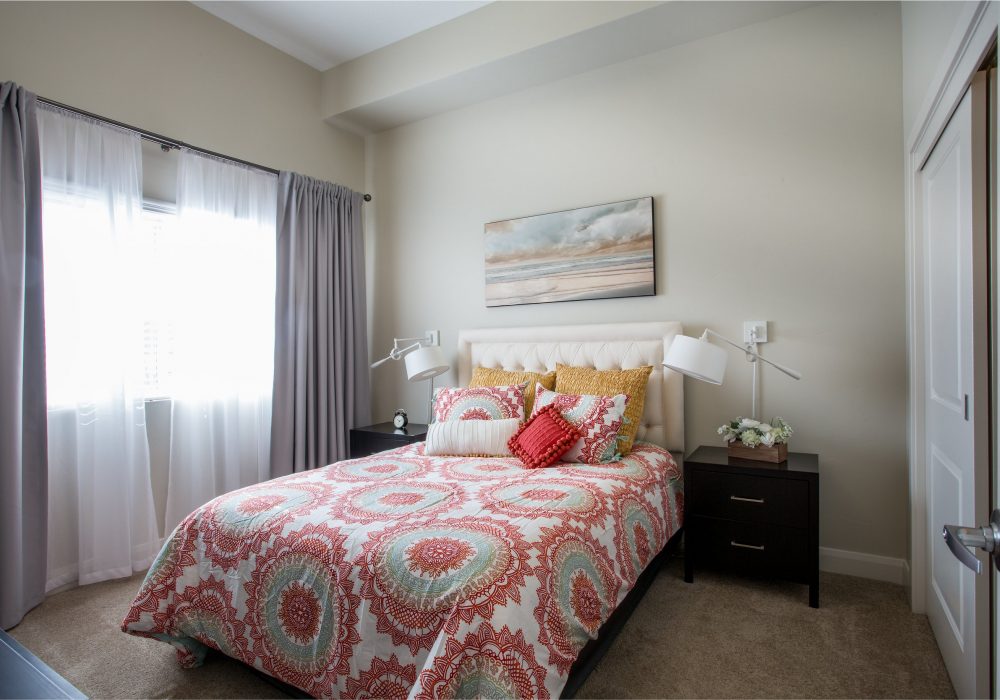 Cozy bedroom with colorful bedding and natural light