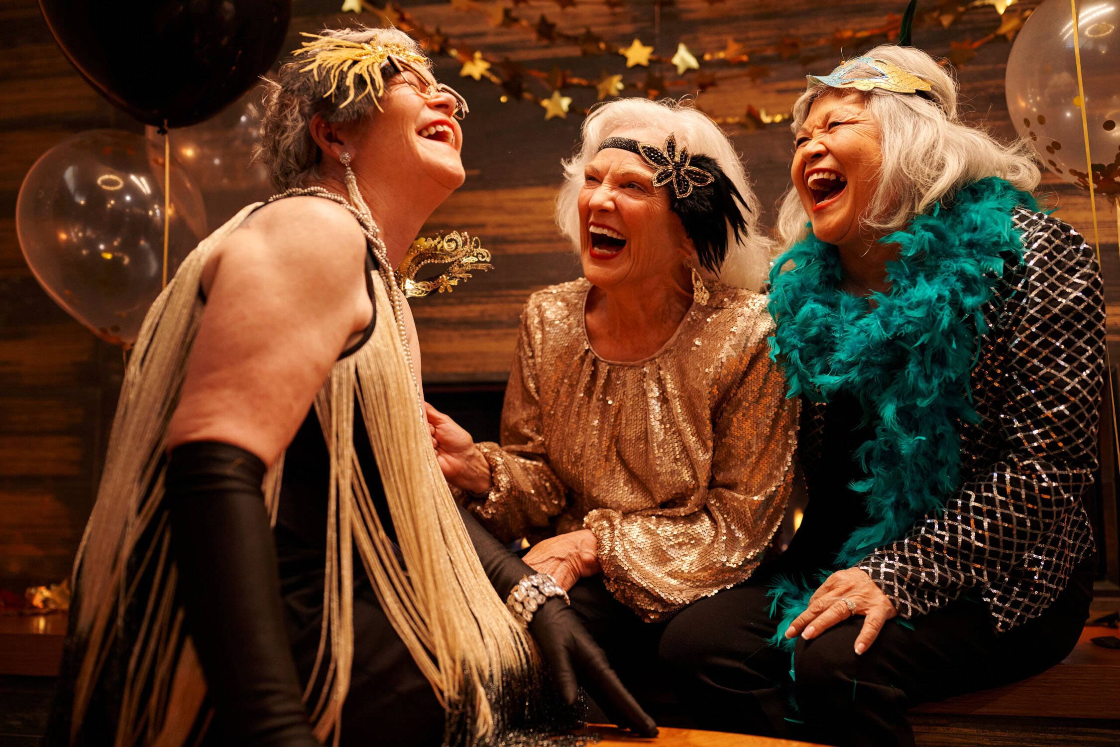 Three residents enjoying a festive celebration together