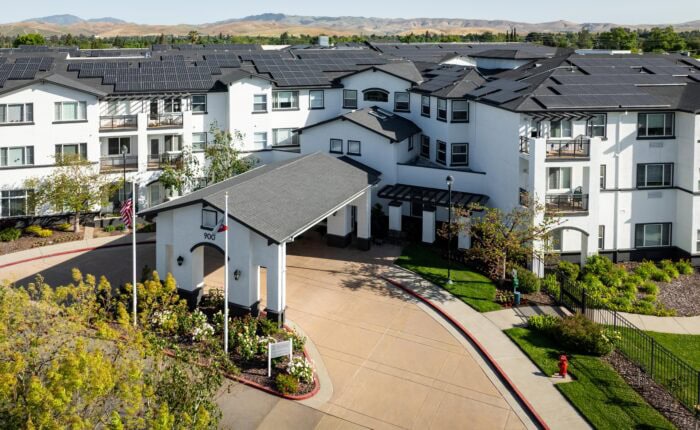 Exterior view of Fairwinds Woodward Park facility with gardens