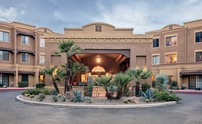 Exterior view of Fairwinds Woodward Park with palm trees