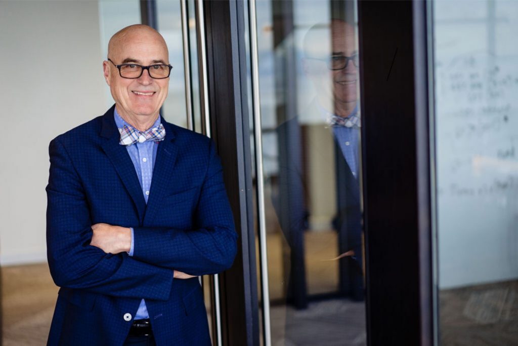 Professional smiling man in a modern office space