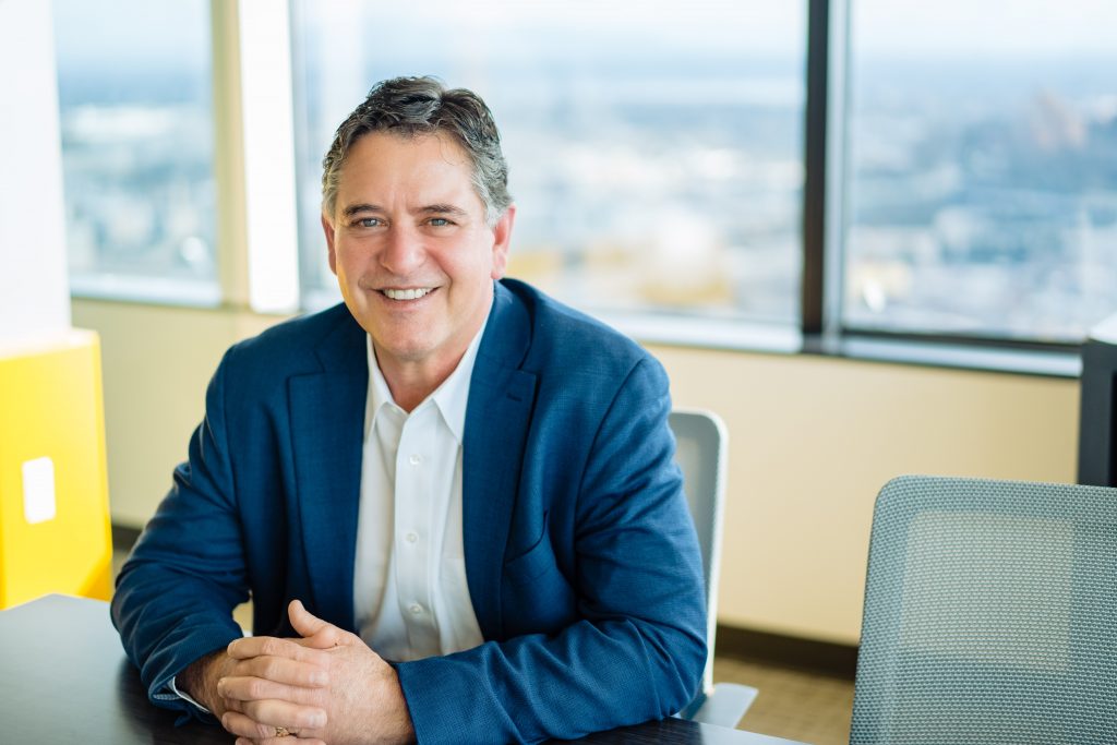 Professional man smiling in an office environment