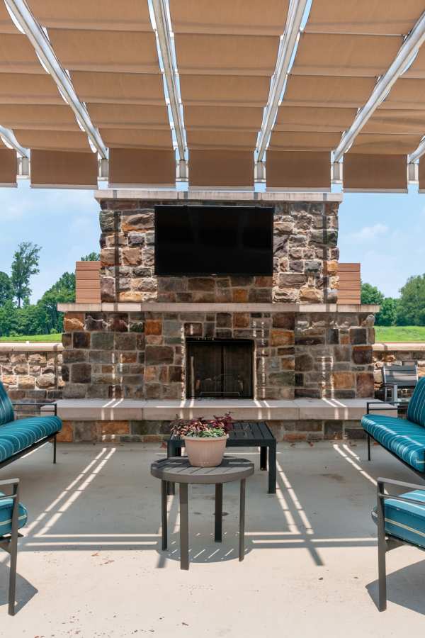 Outdoor seating area with a fireplace.