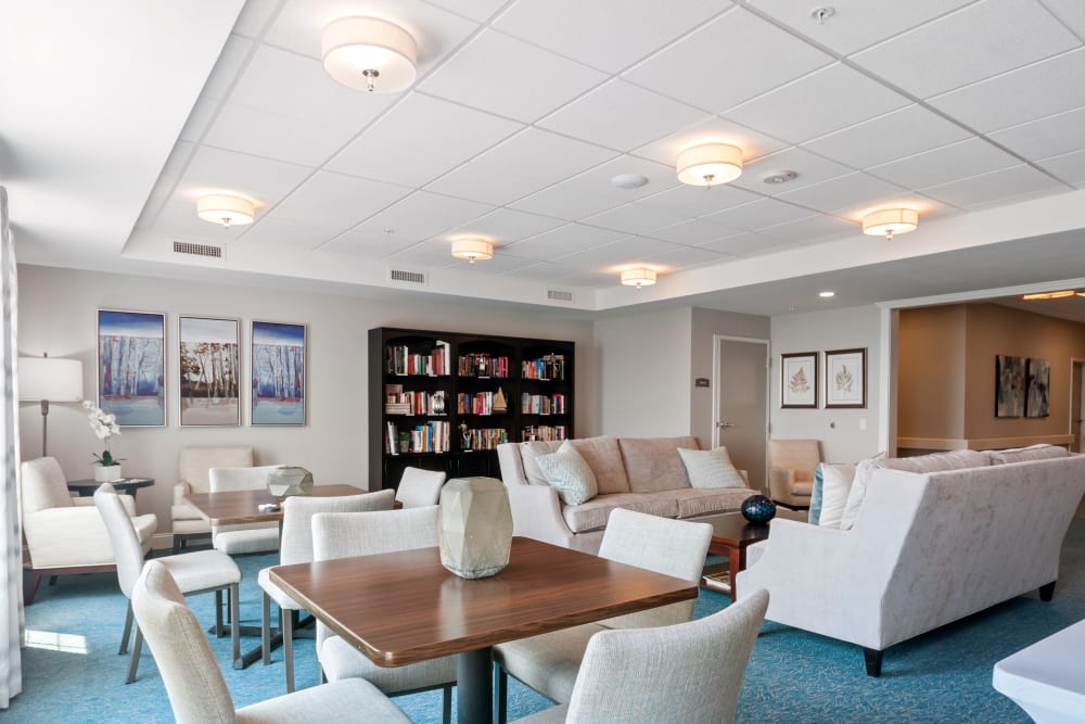 Bright common area with seating and bookshelves