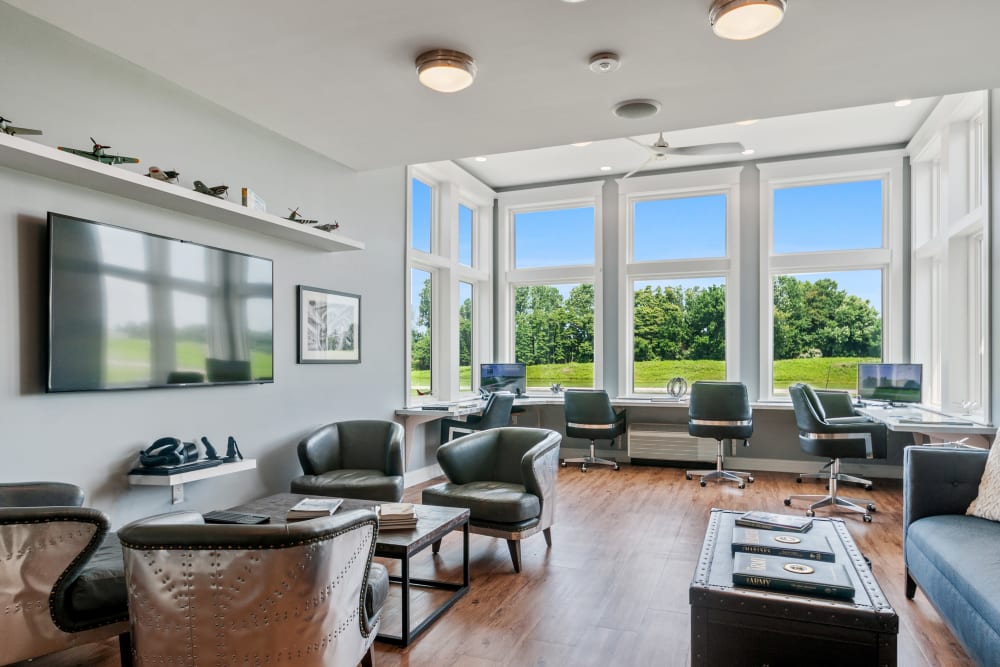 Bright common area with modern furnishings and large windows