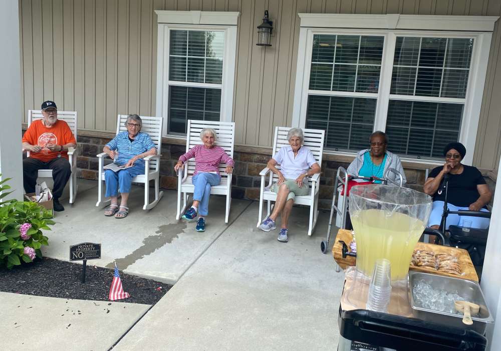 Residents enjoying a warm day on the patio