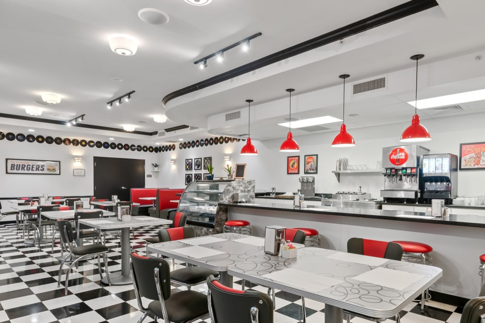 Interior dining area with retro decor and red accents