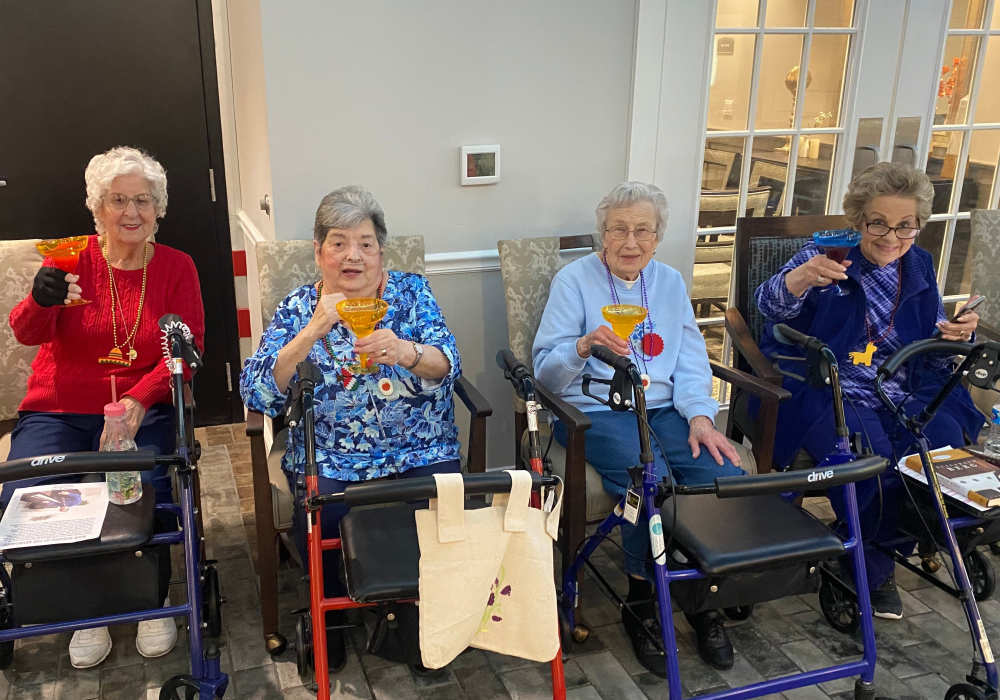 Residents enjoying drinks together in the lounge