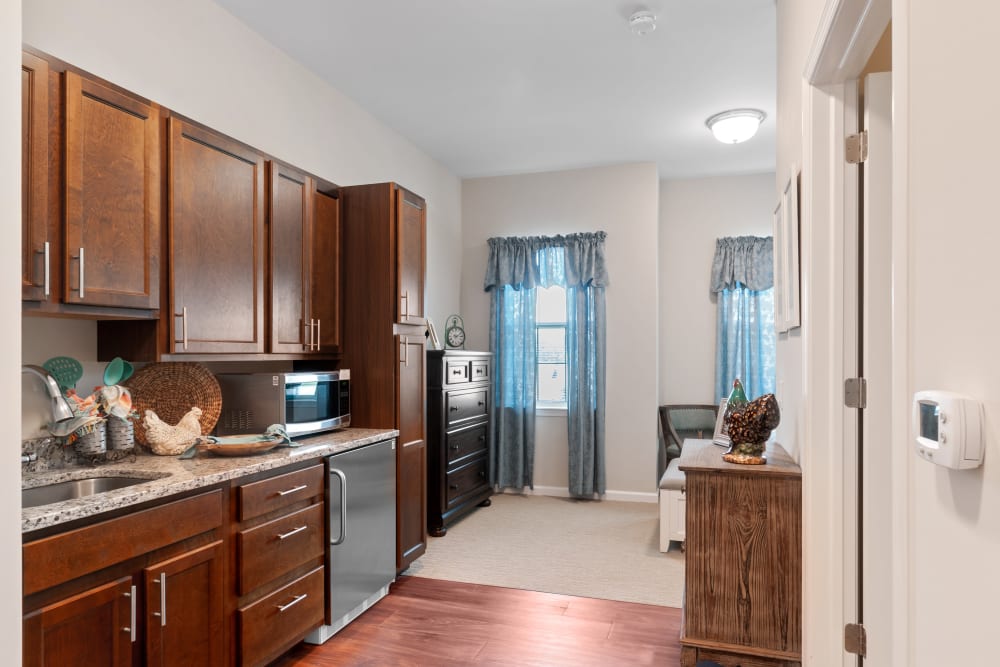 Cozy resident room with kitchen and seating area