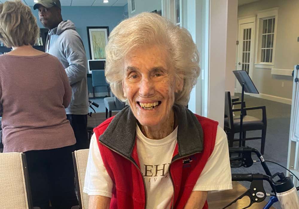 Smiling resident enjoying an activity in the facility