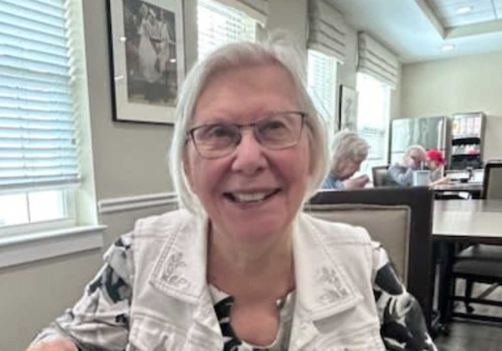 Resident smiling in a common area setting
