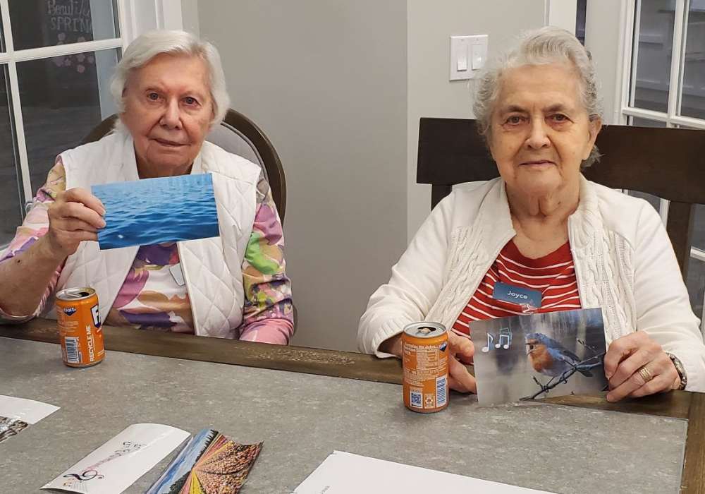 Two residents engaged in an activity at a table