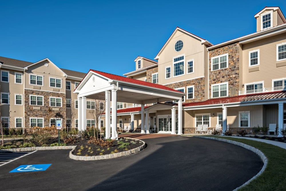 Building exterior with entrance and parking area