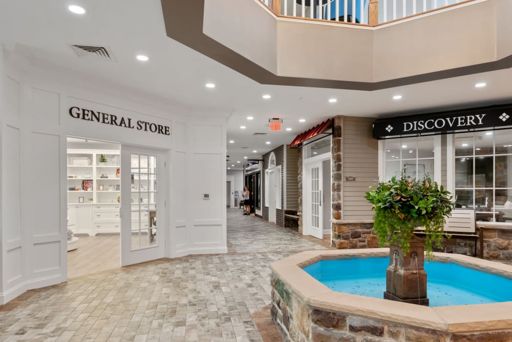 Interior view of a common area with a fountain and store